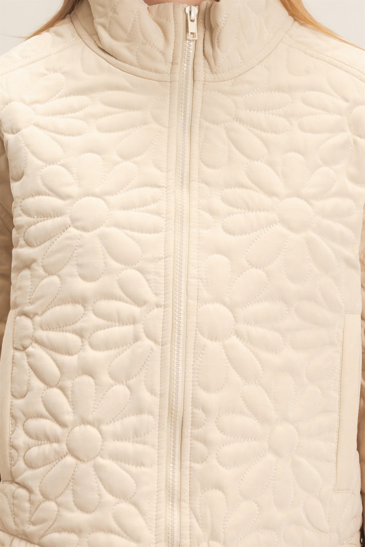 Daisy Quilted Mock Neck Zip Jacket in Cream — close-up of mock neck and full zip-front closure
