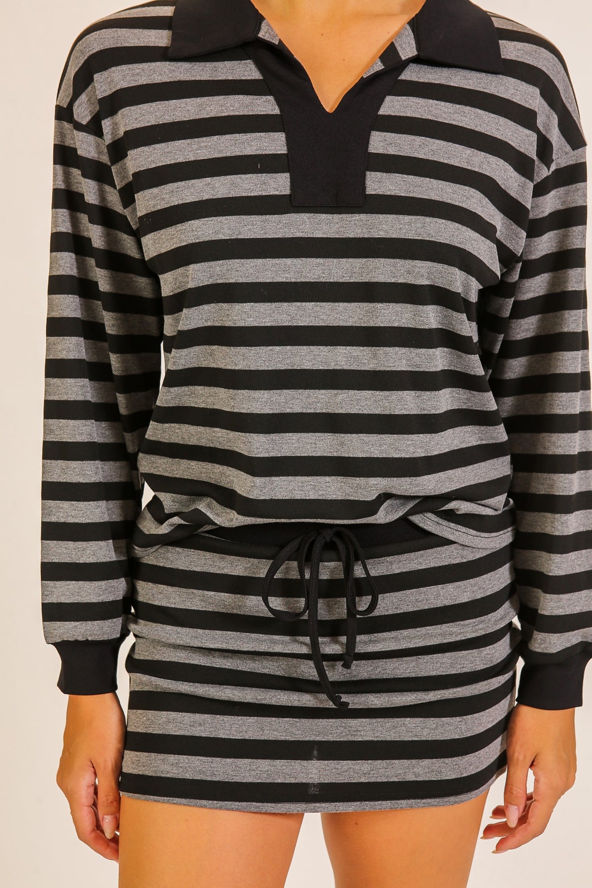 Rally Stripe Collared Top & Skort Set in Black — close-up of stripe print and collared neckline