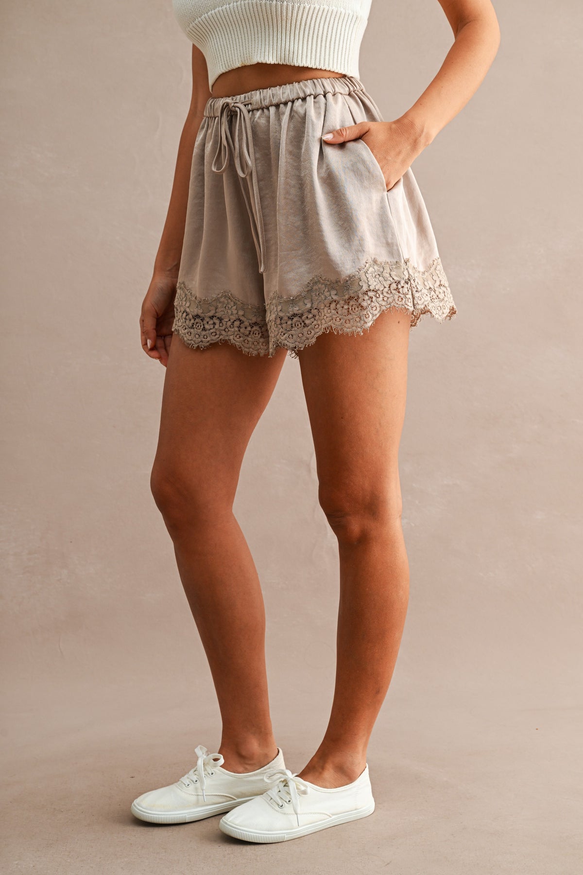 Satin Lace Trim Drawstring Shorts in Taupe — close-up of floral lace hem trim detail