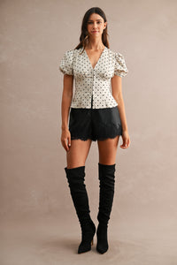 Faux Leather Lace Trim High-Waist Shorts in Black — close-up of concealed front closure and side pocket