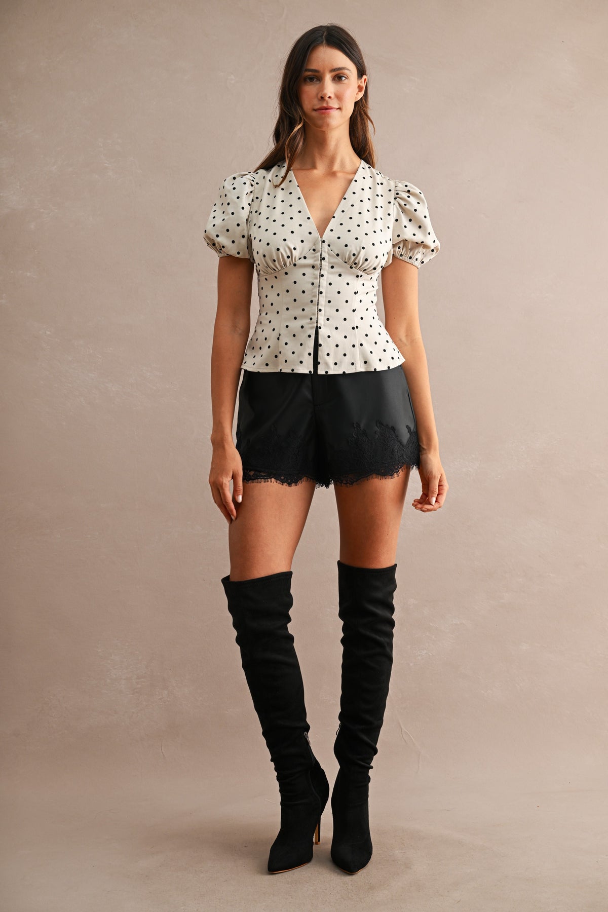 Faux Leather Lace Trim High-Waist Shorts in Black — close-up of concealed front closure and side pocket