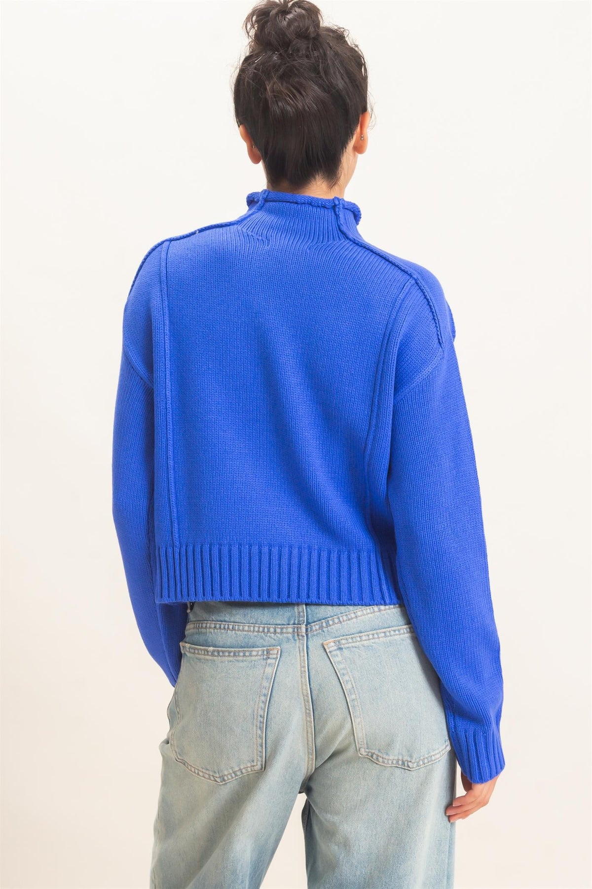 Remy Roll Neck Reversed Seam Sweater in Blue — close-up of reversed seam detail and ribbed neckline