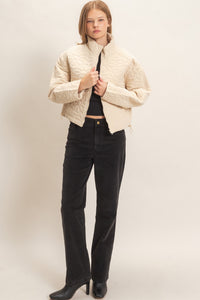Daisy Quilted Mock Neck Zip Jacket in Cream — close-up of daisy quilted pattern and welt pocket