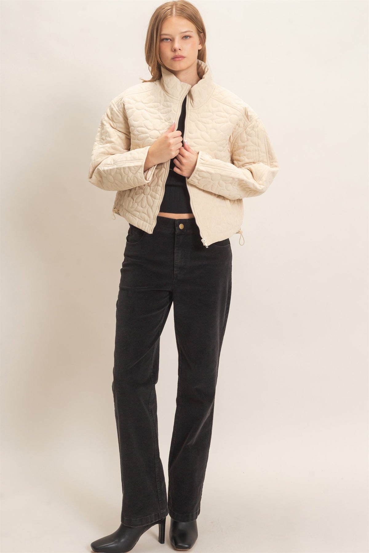Daisy Quilted Mock Neck Zip Jacket in Cream — close-up of daisy quilted pattern and welt pocket