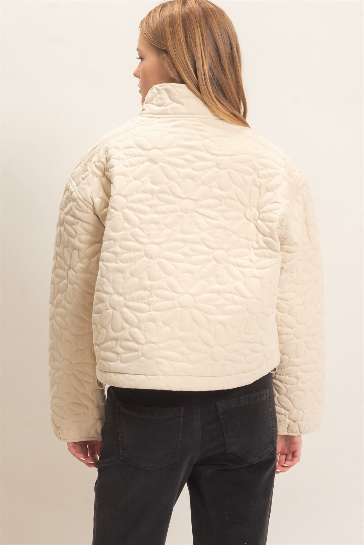 Daisy Quilted Mock Neck Zip Jacket in Cream — side view showing zip front and drawstring hem