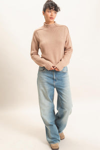 Remy Roll Neck Reversed Seam Sweater in Taupe — close-up of reversed seam detail and ribbed neckline