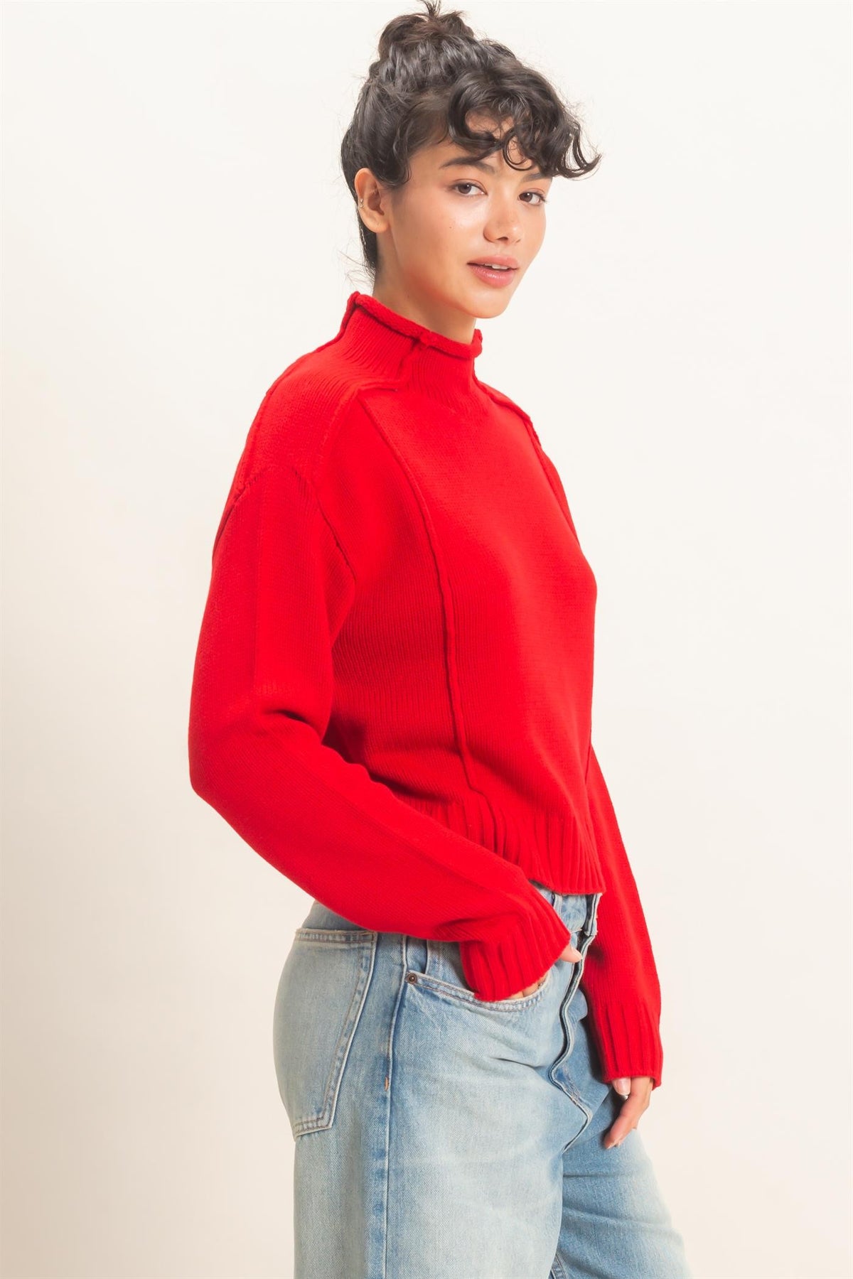 Remy Roll Neck Reversed Seam Sweater in Red — side view showing roll neck and relaxed silhouette